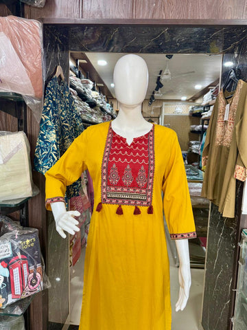 Mustard Ajrakh Print Cotton Suit With Beautiful Tasals