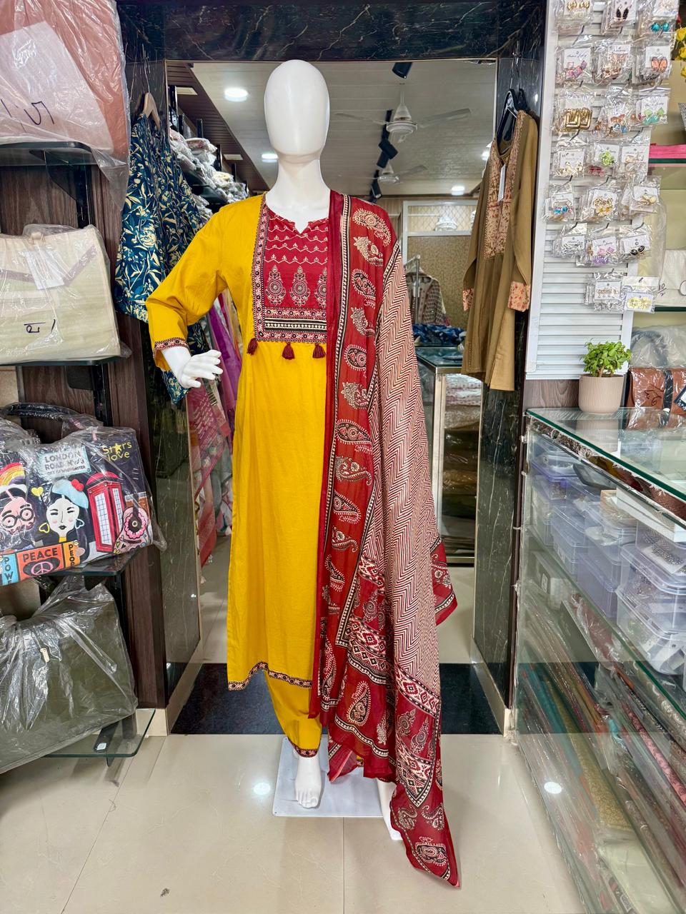 Mustard Ajrakh Print Cotton Suit With Beautiful Tasals